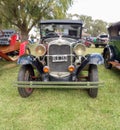 Old black Ford Model A Fordor sedan 1928 - 1931. Nature grass and trees background. Classic car show Royalty Free Stock Photo