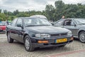 Old black Japanese veteran youngtimer luxury car Toyota Camry