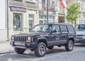 Old black Jeep Cherokee 4x4 car parked