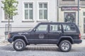 Old black Jeep Cherokee 4x4 car parked