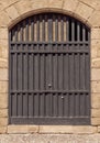 Old black medieval antique castle door in front texture