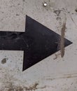 old and black metal arrow sign points to the right Royalty Free Stock Photo