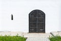 Old black metal door in the monastery Church. Royalty Free Stock Photo