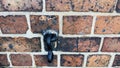 Old Black Metal Hook on a Brick Wall