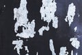 Old black paint peeling from gray concrete wall texture background. Royalty Free Stock Photo