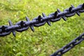 Old black painted massive iron chains with spikes