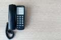 The old black phone on the business office desk in the wood be used for contact Connect, above on table top view Employees are