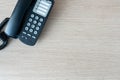 The old black phone on the business office desk in the wood be used for contact Connect, above on table top view Employees are