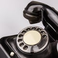 Old black phone with dust and scratches on white background Royalty Free Stock Photo