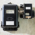 Old black plumbed power meter Royalty Free Stock Photo
