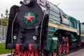 Old black and red retro steam locomotive at the railway station. Vintage train staying on the railroad. Royalty Free Stock Photo