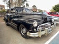 Old black 1940s Buick Eight Special four door sedan in a park. AAA 2022 classic car show. Royalty Free Stock Photo