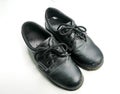 Old black safety shoes that have been used a lot and are dirty for a long time. White background isolated Royalty Free Stock Photo