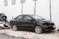 Old black sedan parked