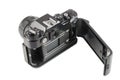 Old black SLR camera with open back cover Royalty Free Stock Photo