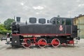 Old black small steam engine or locomotive in a train station in Torun, Poland Royalty Free Stock Photo