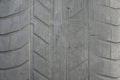 Old black tire with worn tread and cracks, worn old car tire tread, old damaged, worn black tire tread, large cracks in the car wh Royalty Free Stock Photo