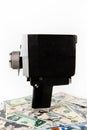 An old black video camera is on the US dollar bills. Video creator and money Royalty Free Stock Photo