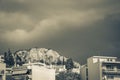 Dark black storm clouds over Greek city panorama Athens Greece