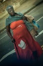 Old black woman crossing street