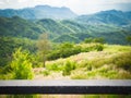 Old black Wood floor design perspectives blur green natural and mountains background Royalty Free Stock Photo