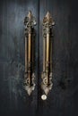 Old black wooden church door with antique door handles Royalty Free Stock Photo