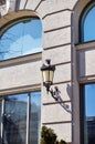 Old black wrought iron street lamp on wall Royalty Free Stock Photo