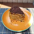 Old blackforest cake on an orange plate