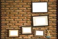 Old blank frames with white background on brick wall Royalty Free Stock Photo