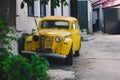 Old luxury vintage yellow car Pobyeda. Old antique car little bit rusty Royalty Free Stock Photo