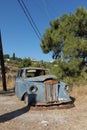 Old blue abandonned car samos greece road side car wreck