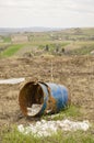 Old blue barrel in the field