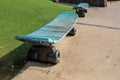 Old blue bench similar to a skateboard Royalty Free Stock Photo