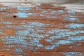 Old blue board with cracked paint, vintage wood background, grunge plank. Old wooden background with remains of pieces of scraps Royalty Free Stock Photo