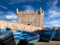Old blue boats in harbour of Essaouira in Morocco