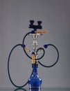 An old blue ceramic hookah on a grey background Royalty Free Stock Photo