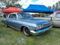 Old blue 1962 Chevrolet Chevy Impala sedan by GM on the lawn