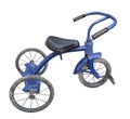 Old blue child's tricycle isolated.