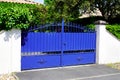 Old blue classic metal home gate at entrance of house portal garden Royalty Free Stock Photo