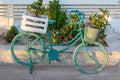 Old blue decorative bike with flowers - street or garden decoaration ideas