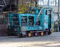 Old blue diesel locomotive in a workshop