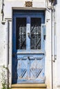 Old blue door with black wrought details