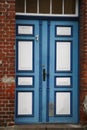 An old blue door of a very old house with the number 1 Royalty Free Stock Photo