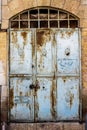 Old blue durty, dirty door with rusty and openwork a beautiful vintage background