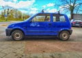 Old blue Fiat Cinquecento two doors parked Royalty Free Stock Photo