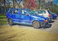 Old blue Fiat Uno four doors parked