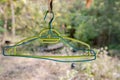 Old blue and green hangers hanging under the roof of the house Royalty Free Stock Photo