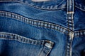 Old blue jeans seam detail cloth of denim for pattern and classic background close up Royalty Free Stock Photo