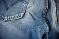 Old blue jeans seam detail cloth of denim for pattern and classic background close up Royalty Free Stock Photo