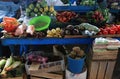 Old blue Market stand with lots of different fresh fruits and vegetables